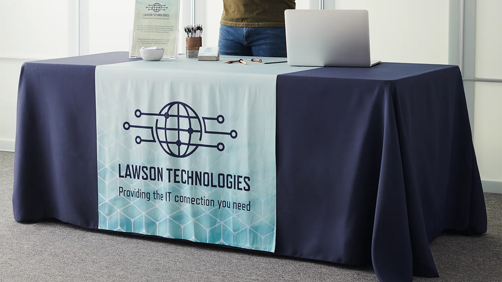 a laptop on advertising table covers